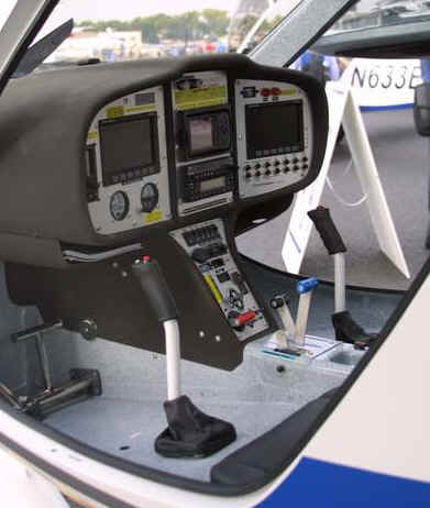 The large instrument panel stretches from one side of the 39 inch wide cockpit to the other, and is divided into three sections, one for flight instruments, one for navigation a third for engine monitoring.